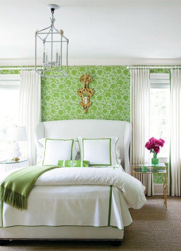 green wall design for bedroom with a white bed