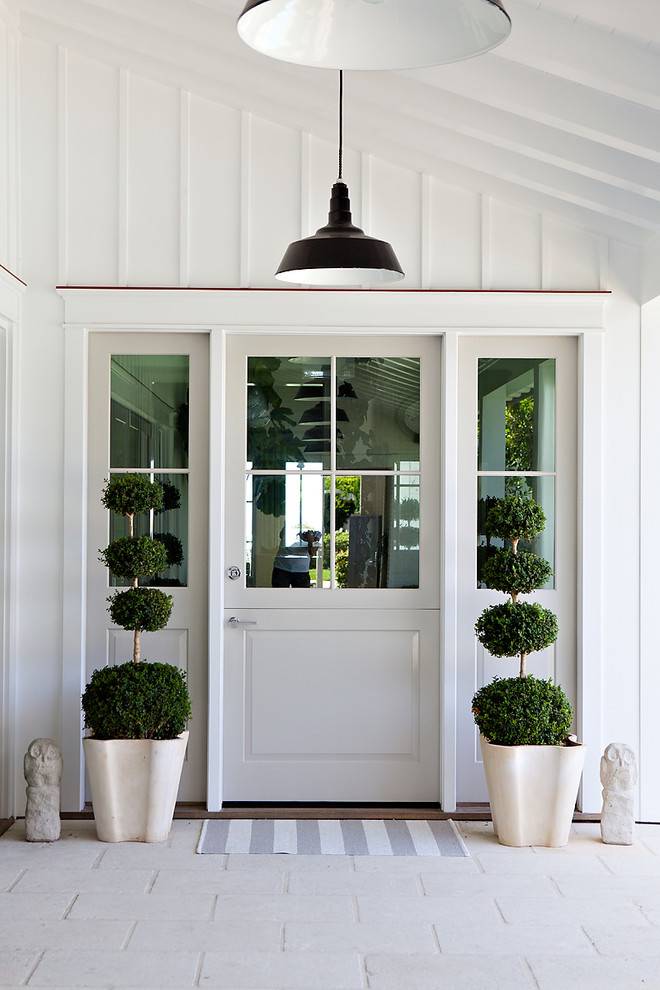 beach style entry with pendant lights