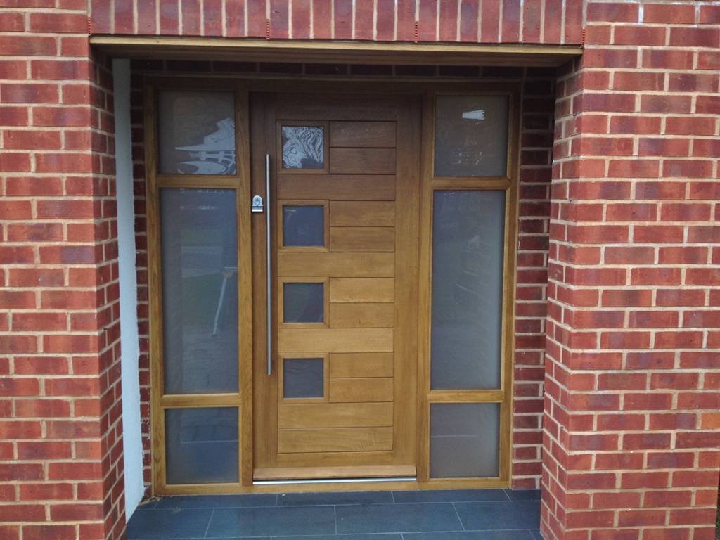 Contemporary front door with double side glass and modern furniture