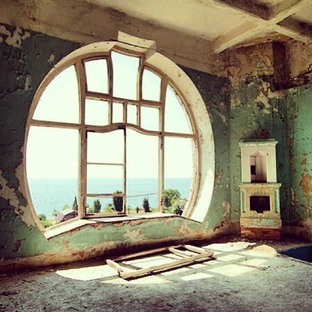 Cool unusual window for attic room in abandoned house