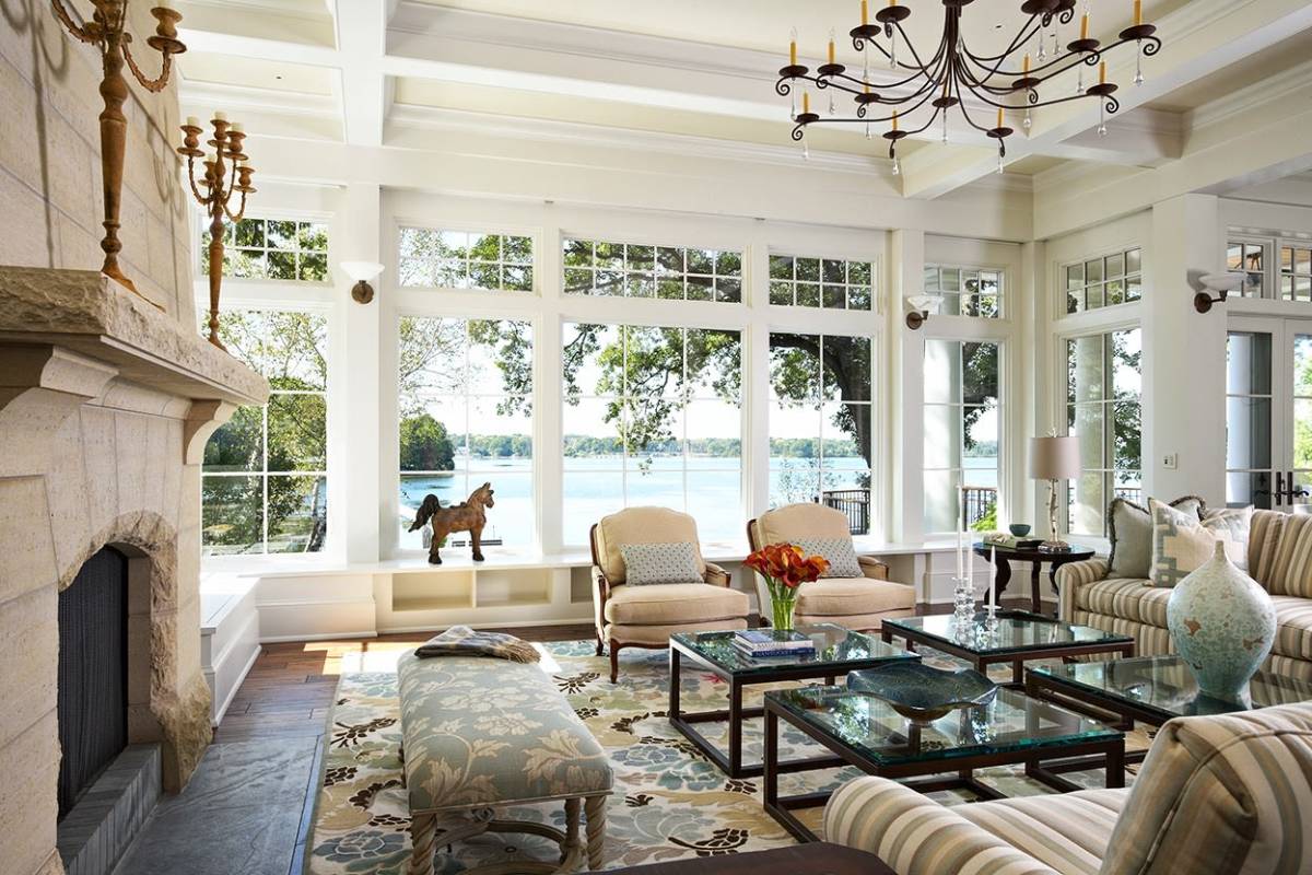 Great example of lake house living room window design