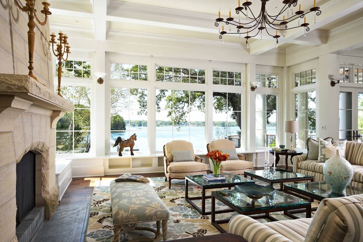 Great example of lake house living room window design