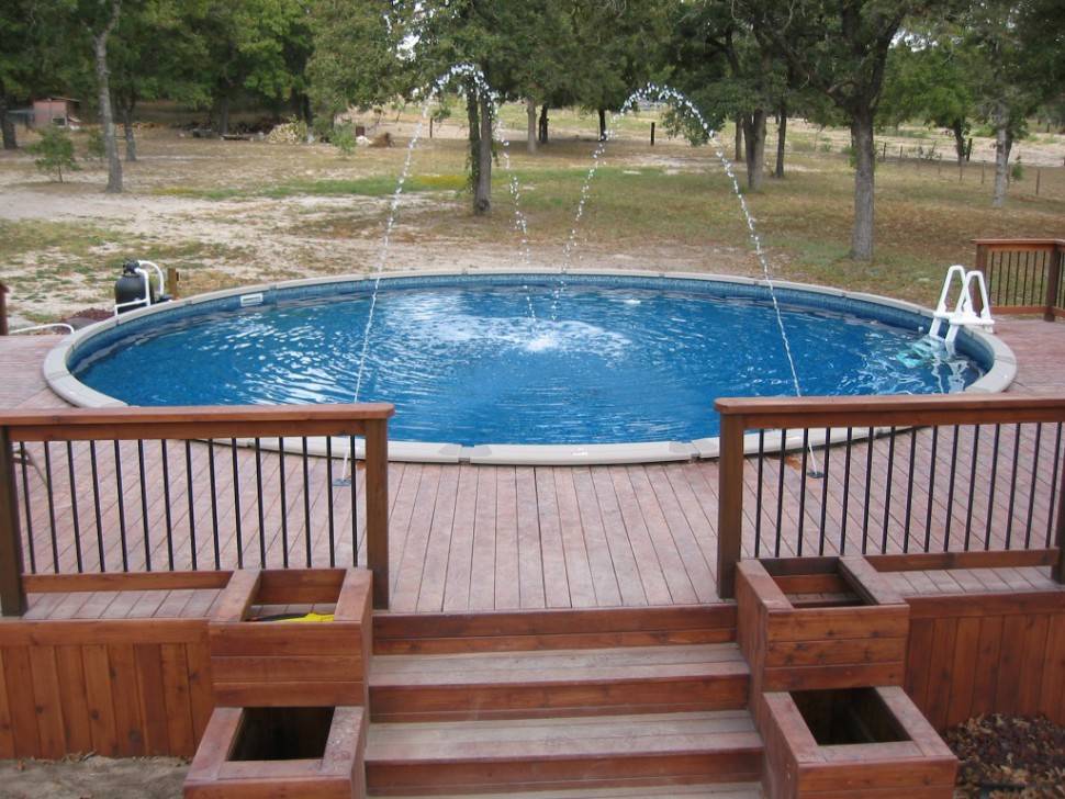 backyard-design-with-small-round-pool-feat-brown-wood-above-ground-wood-pool-deck-970x728