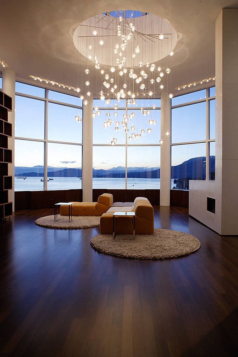 beautiful chandelier for living space paired with sofa and round rug on dark hardwood floor