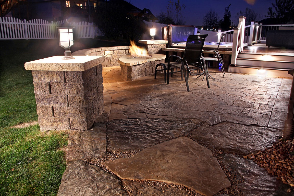 Chic Fire Place Made of Stone also Led Patio Lighting Ideas with Black Chair