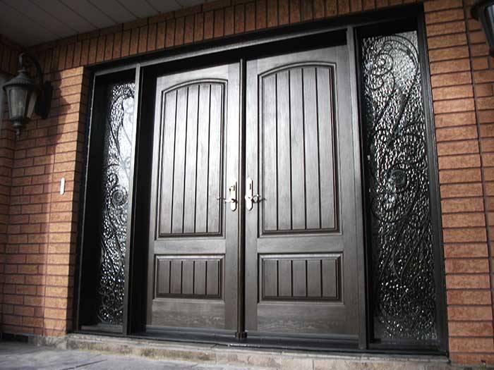 Rustic-Doors-Woodgrain-Double-Solid-Front-Door-with-2-Iron-Art-Side-Lits-Installed-by-Windows-and-Doors-Toronto-in-Thornhill-Ontario