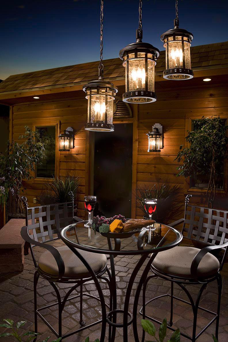 Stylish Patio Lighting Ideas with Rustic Chandelier above Glass Table and Metal Chair