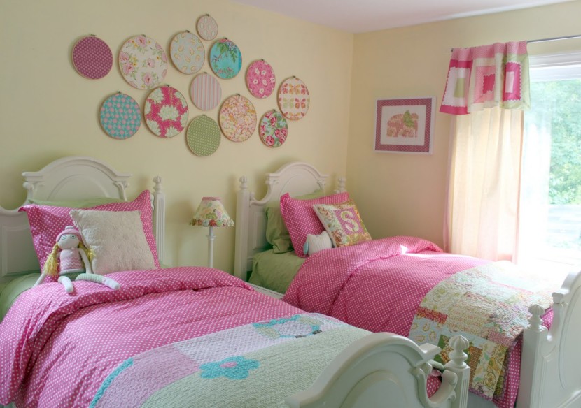 Interior, Best Girls Rooms Interior Design Ideas Captivating Girl Rooms Design Ideas With White Wooden Color Twin Bed Frames And Combine With Colorful Pattern Covered Bedding Sheets And Pillows Also Combine With Round Shape Patchwork Pattern Wall Ornaments Also Cream Wall Paint Color And Wooden Side Table With Drawers And Table Lamp Also Glass Windows With White Curtain Color With Home Decor Ideas And Teenagers Bedrooms