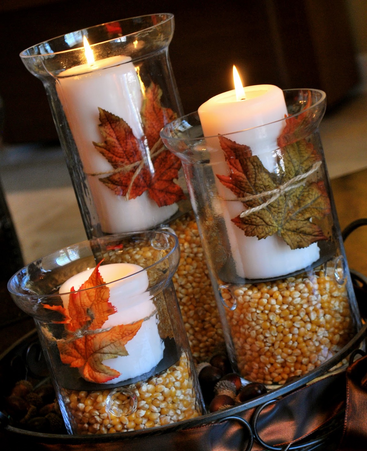 candels decorated with pressed leaves