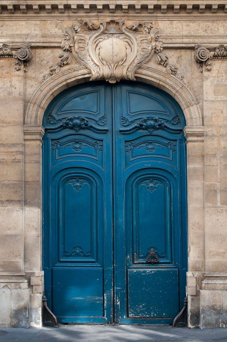 exterior-classic-front-door-design-of-double-blue-painted-door-designed-with-cuve-frame-and-natural-brown-stone-wall-and-cool-ornate-decoration-ornate-front-doors-ideas