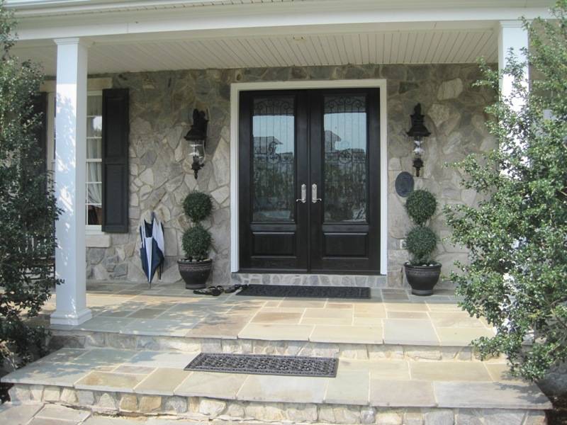 rustic double entry front doors with glass and iron