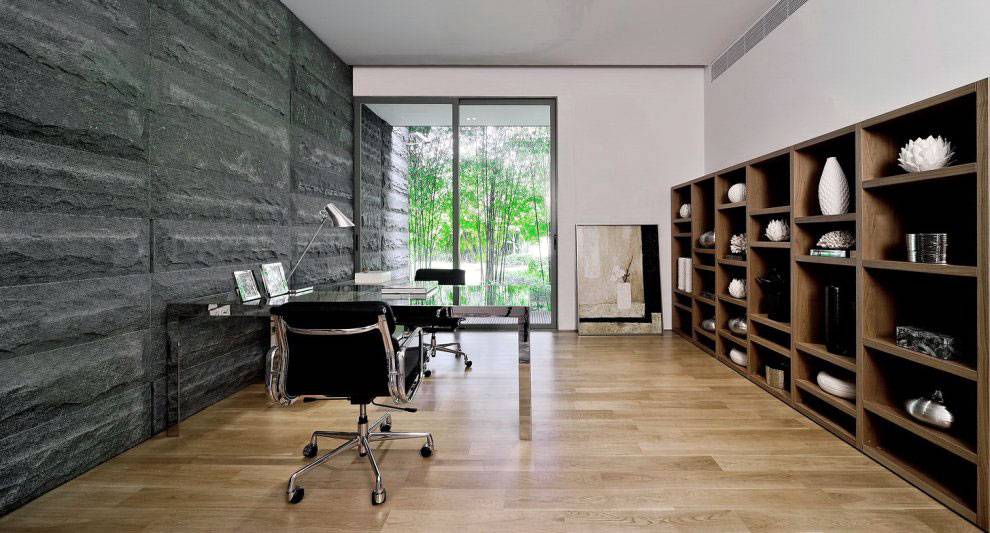 Modern home office design with black stone walls