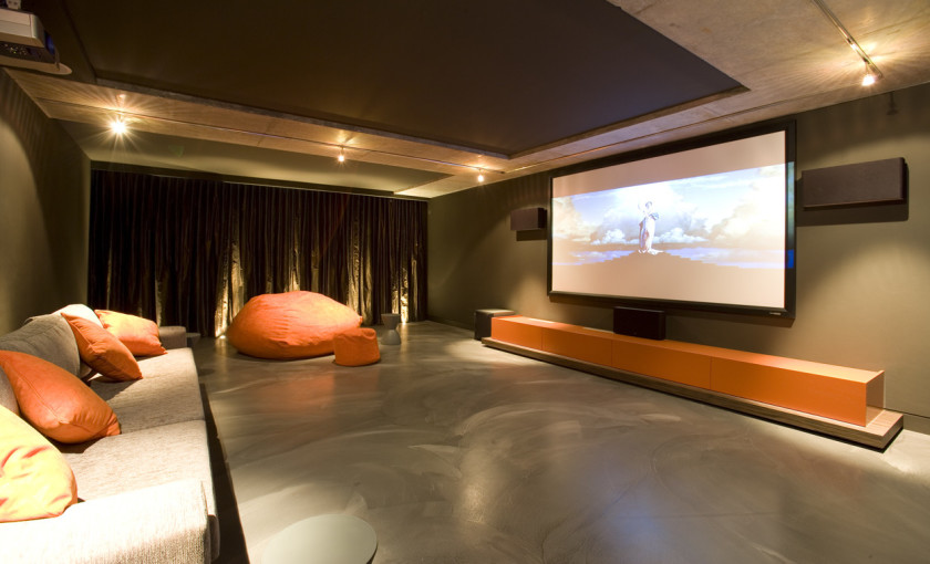 Interior, Amusing Design Ideas Of Home Cinemas Magnificent Design Ideas Of Home Cinema With Rectangle Shape Large Flat Screen Also Front Speaker And Subwoofer Also Cream Color Comfy Couch Also Orange Cushions And Cream Color Marble Floor And Clear Down Lights Also Brown Curtains With Home Improvement Ideas And Kitchen Decorating Ideas