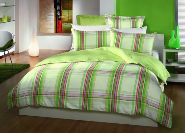 green bedding in the bedroom