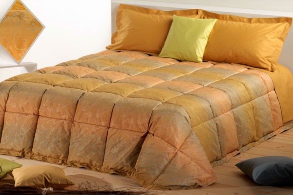 orange bedding in the bedroom