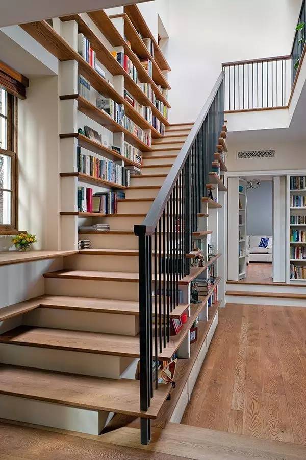 Bookshelves in the staircase as a great idea of space-saving techniques