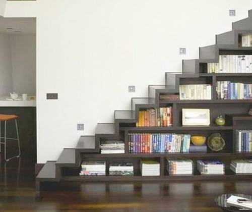 Bookshelves in the staircase as a great idea of space-saving techniques