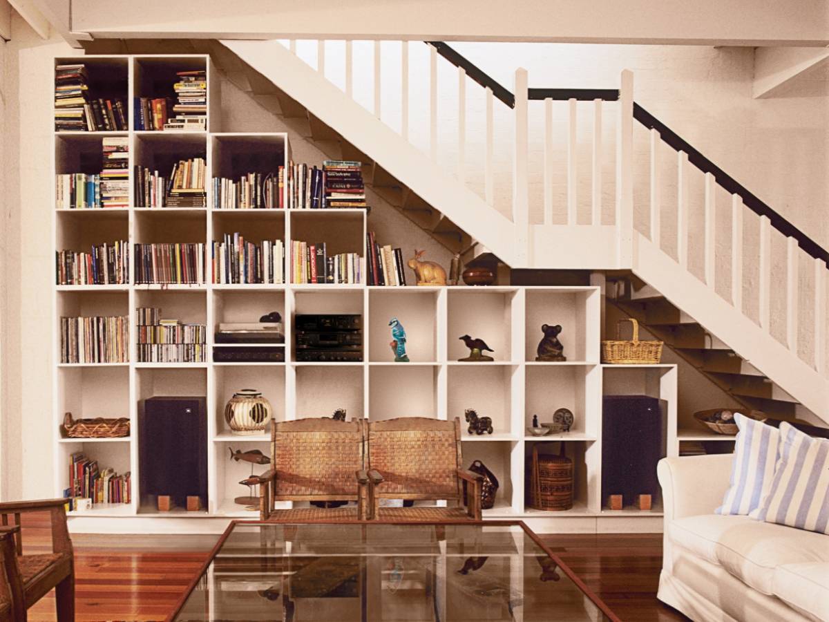 Bookshelves in the staircase as a great idea of space-saving techniques