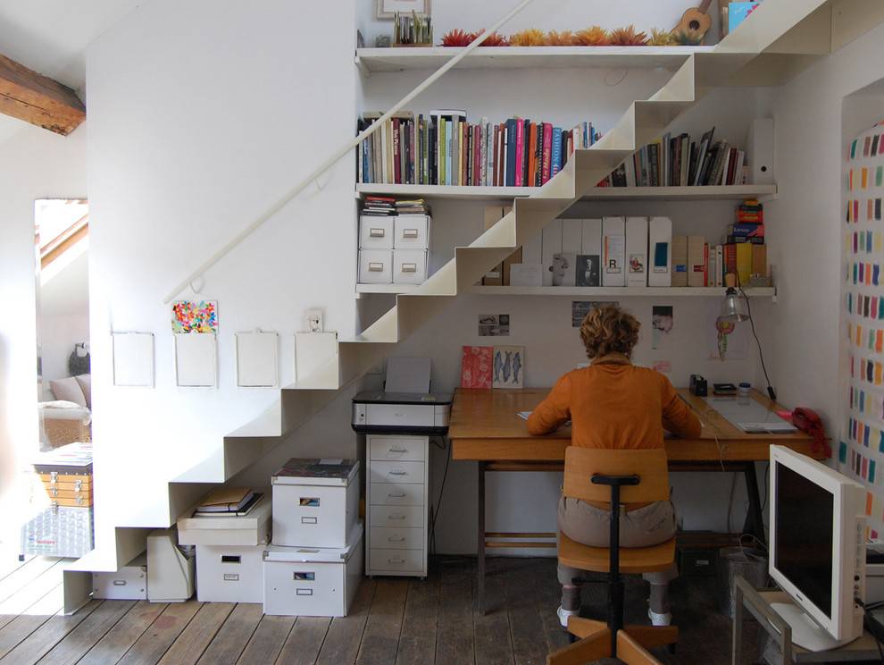 Bookshelves in the staircase as a great idea of space-saving techniques