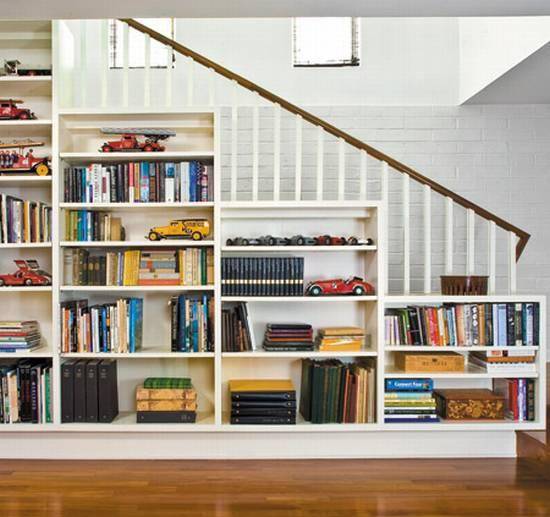 Bookshelves in the staircase as a great idea of space-saving techniques