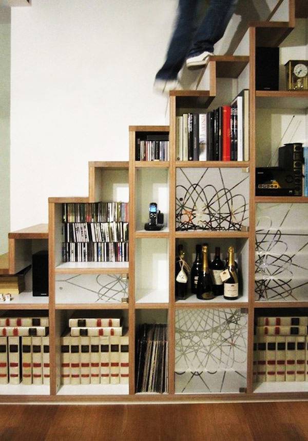 Bookshelves in the staircase as a great idea of space-saving techniques