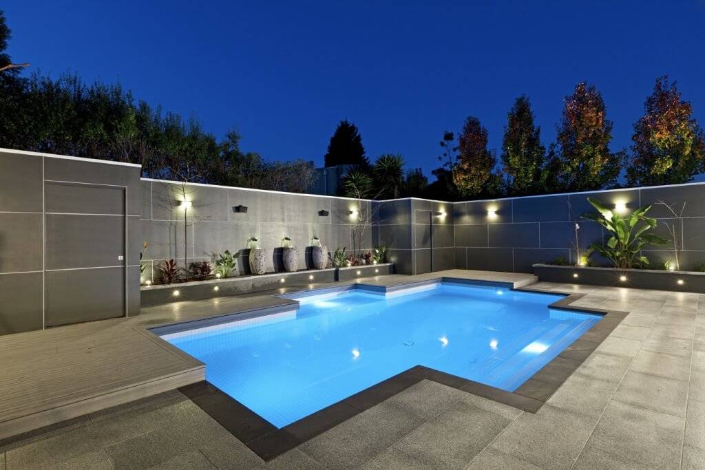 Luxurious and Elegant Swimming Pool Design with Attractive Lighting and Marble Flooring