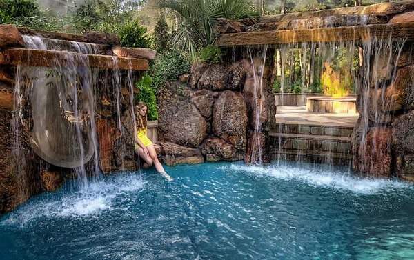 backyard-pool-waterfalls-fire-pit-and-slide-swimming-pool-design-ideas