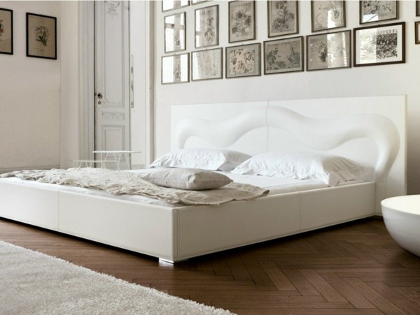 white bedroom set photo wall hardwood floors leather headboard