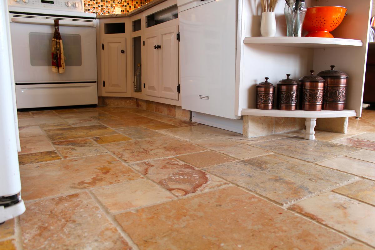 a kitchen with white and marble counter tops is pictured in